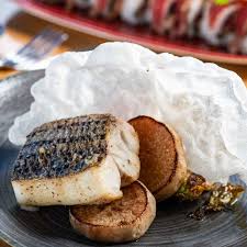 Orion’s Roof signature dishes Tuna Pizza, Miso Glazed Sea Bass, specialty sushi rolls, Crispy Rice Spicy Tuna